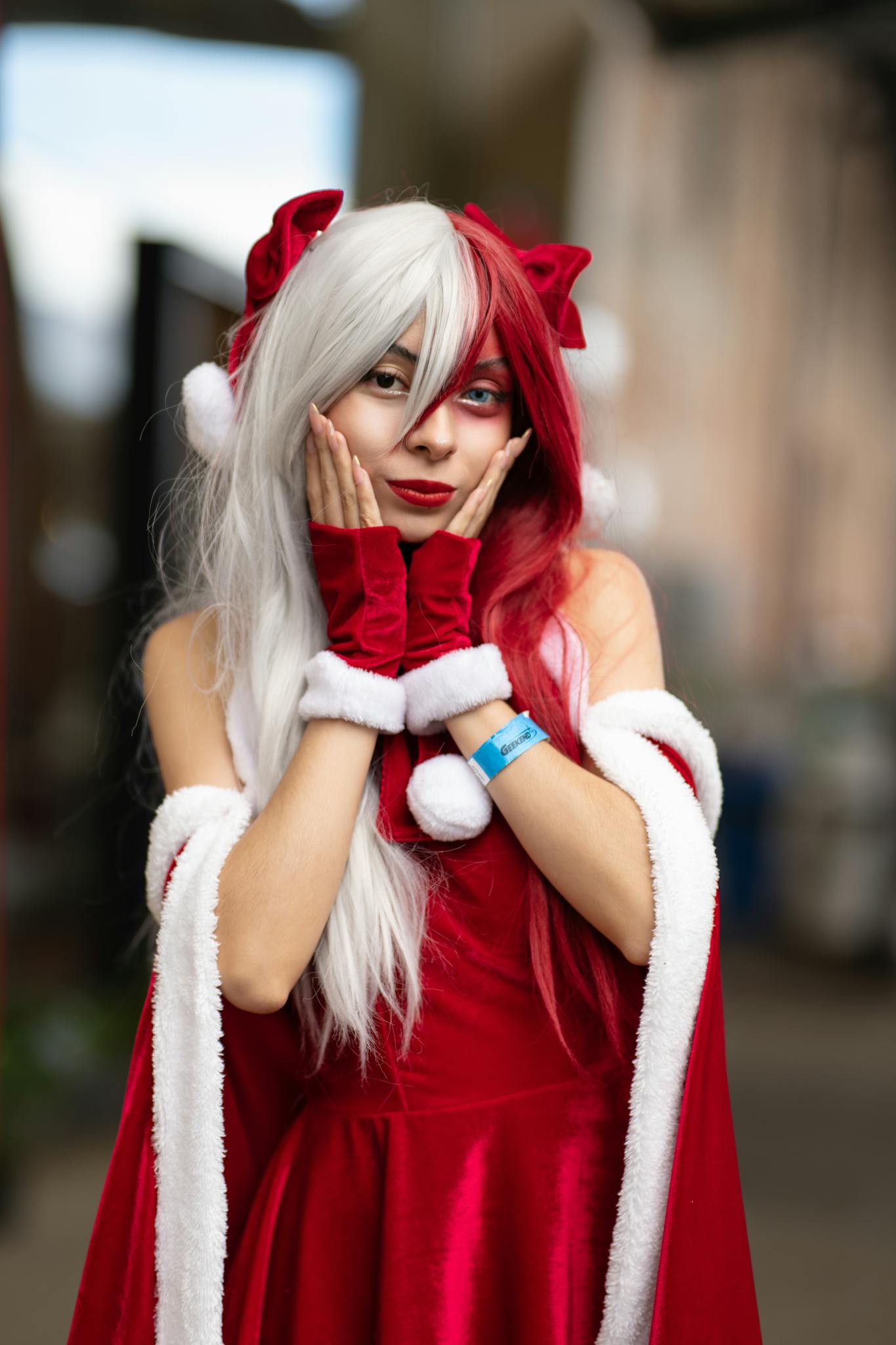 Vibrant anime cosplay character in red and white costume outdoors in San José, Costa Rica.